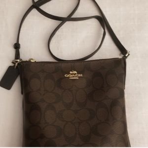 Coach Cross over purse slightly warn on strips